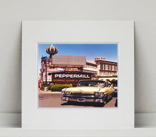 Load image into Gallery viewer, 'The Silver State' was taken by Richard whilst at Viva Las Vegas 2001, where he was photographing for Classic American magazine. This photograph which shows a vintage car in front of a typical Las Vegas backdrop was chosen as the lead image for the magazine feature which focused on the iconic La Concha motel.