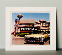 Load image into Gallery viewer, 'The Silver State' was taken by Richard whilst at Viva Las Vegas 2001, where he was photographing for Classic American magazine. This photograph which shows a vintage car in front of a typical Las Vegas backdrop was chosen as the lead image for the magazine feature which focused on the iconic La Concha motel.