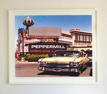 Load image into Gallery viewer, 'The Silver State' was taken by Richard whilst at Viva Las Vegas 2001, where he was photographing for Classic American magazine. This photograph which shows a vintage car in front of a typical Las Vegas backdrop was chosen as the lead image for the magazine feature which focused on the iconic La Concha motel.