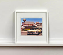 Load image into Gallery viewer, 'The Silver State' was taken by Richard whilst at Viva Las Vegas 2001, where he was photographing for Classic American magazine. This photograph which shows a vintage car in front of a typical Las Vegas backdrop was chosen as the lead image for the magazine feature which focused on the iconic La Concha motel.