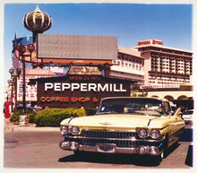 Load image into Gallery viewer, 'The Silver State' was taken by Richard whilst at Viva Las Vegas 2001, where he was photographing for Classic American magazine. This photograph which shows a vintage car in front of a typical Las Vegas backdrop was chosen as the lead image for the magazine feature which focused on the iconic La Concha motel.