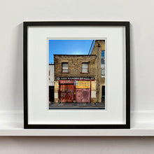Load image into Gallery viewer, East London brick building architecture street photography by Richard Heeps framed in black.
