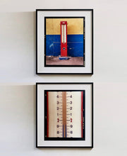 Load image into Gallery viewer, A red retro tyre pump against a yellow and blue painted wall, in the Porta Genova area of Milan. 