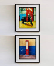 Load image into Gallery viewer, A black vespa against a red, blue and yellow interior. Photographed in Milan, Italy. 