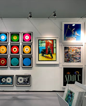 Load image into Gallery viewer, A black vespa against a red, blue and yellow interior. Photographed in Milan, Italy. 