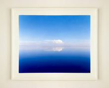 Load image into Gallery viewer, 'View from Bombay Beach' looks over Salton Sea in California. Cooling shades of blue, reflection and symmetry are key to this serene waterscape. The suspended cloud which looks surreal creates a feeling of weightlessness. 