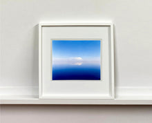 Load image into Gallery viewer, 'View from Bombay Beach' looks over Salton Sea in California. Cooling shades of blue, reflection and symmetry are key to this serene waterscape. The suspended cloud which looks surreal creates a feeling of weightlessness. 
