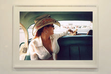 Load image into Gallery viewer, Wendy and Dolls, from Richard Heeps 'Man's Ruin' Series, this is part of a sequence of artworks capturing Wendy at the Rockabilly Weekender, Viva Las Vegas. This cinematic portrait of Wendy captures her in the back seat of her classic American Oldsmobile.