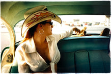 Load image into Gallery viewer, Wendy and Dolls, from Richard Heeps 'Man's Ruin' Series, this is part of a sequence of artworks capturing Wendy at the Rockabilly Weekender, Viva Las Vegas. This cinematic portrait of Wendy captures her in the back seat of her classic American Oldsmobile.