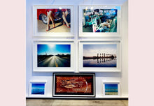 Load image into Gallery viewer, Zzyzx Resort Pool, part of Richard Heeps 'Dream in Colour' Series, he was set a challenge to find something interesting on the road from LA to Las Vegas. In the heart of the Mojave Desert, Richard found the former spa Zzyzx, an oasis. This dreamy artwork keeps the perfect summery palm print vibe all year round.